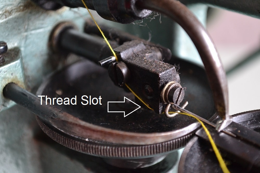 The needle bar tension plate