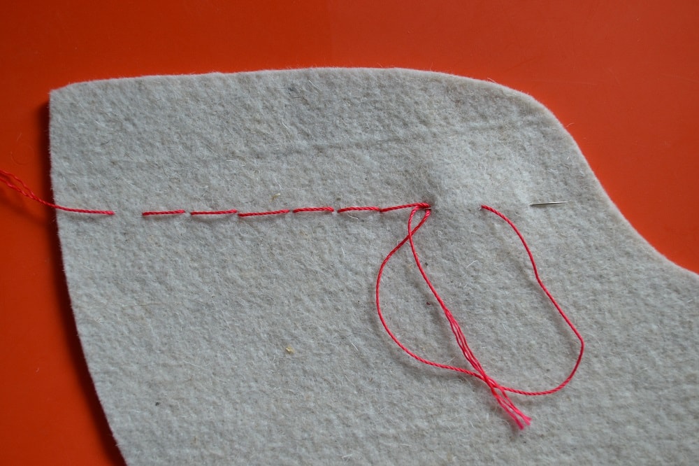 Face side of fabric with back stitches