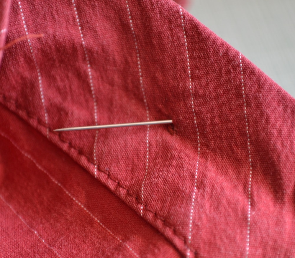 Pierce the needle through the fabric