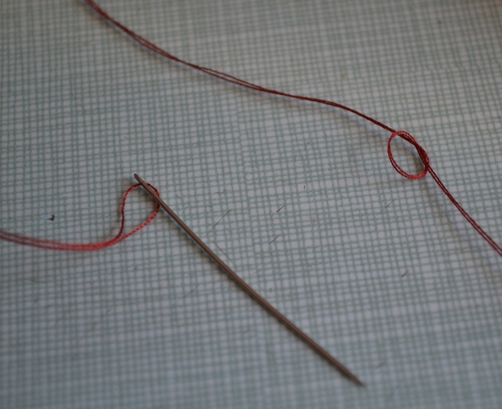 Thread needs tie together
