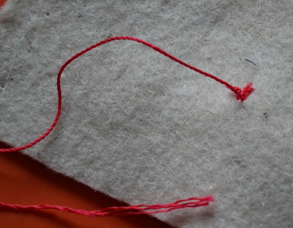 How to make another knot on wrong side a fabric