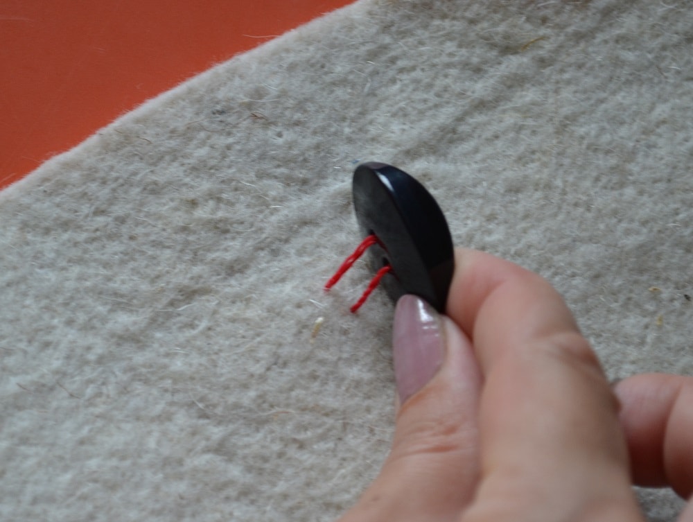 How to Sew a Button by Hand, step 2