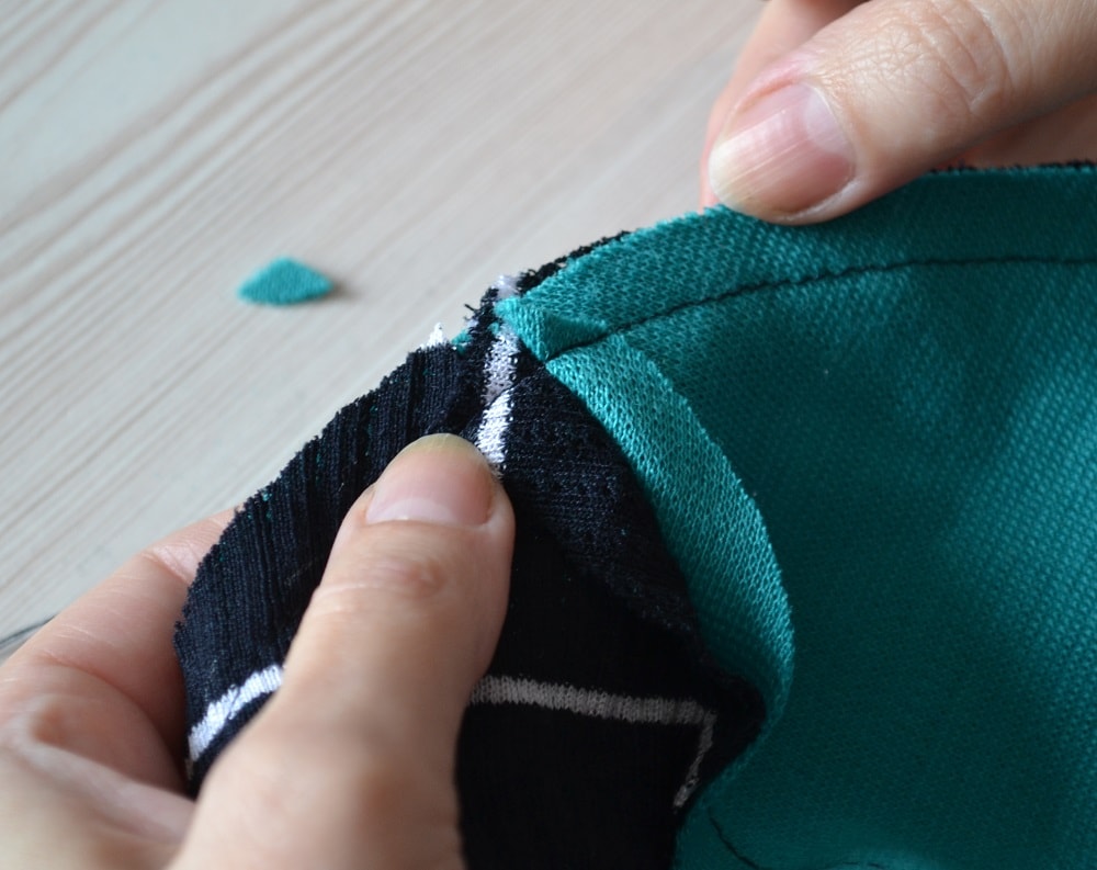 Trim the top corners of seam allowances