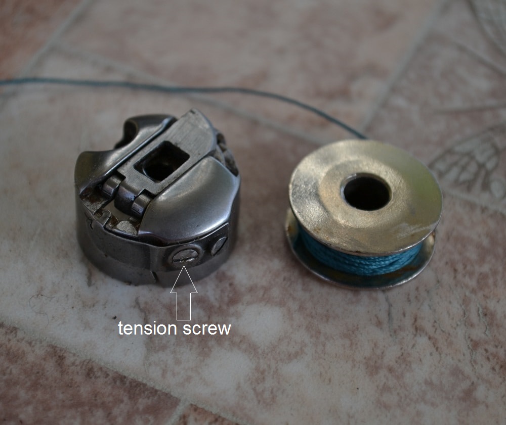 Bobbin case tension adjustment