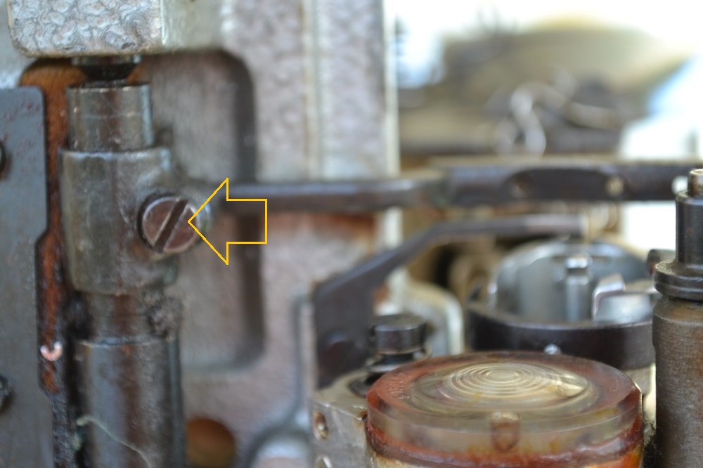 Width of gap is regulated with screw