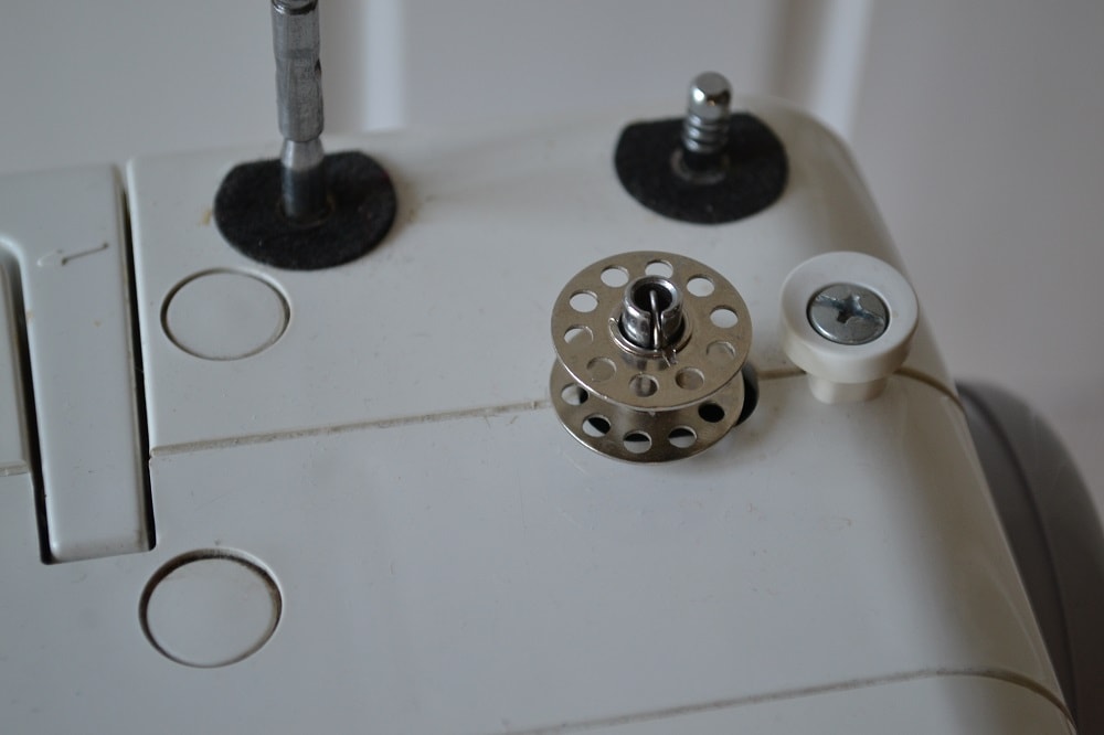 Now you can to start threading a bobbin