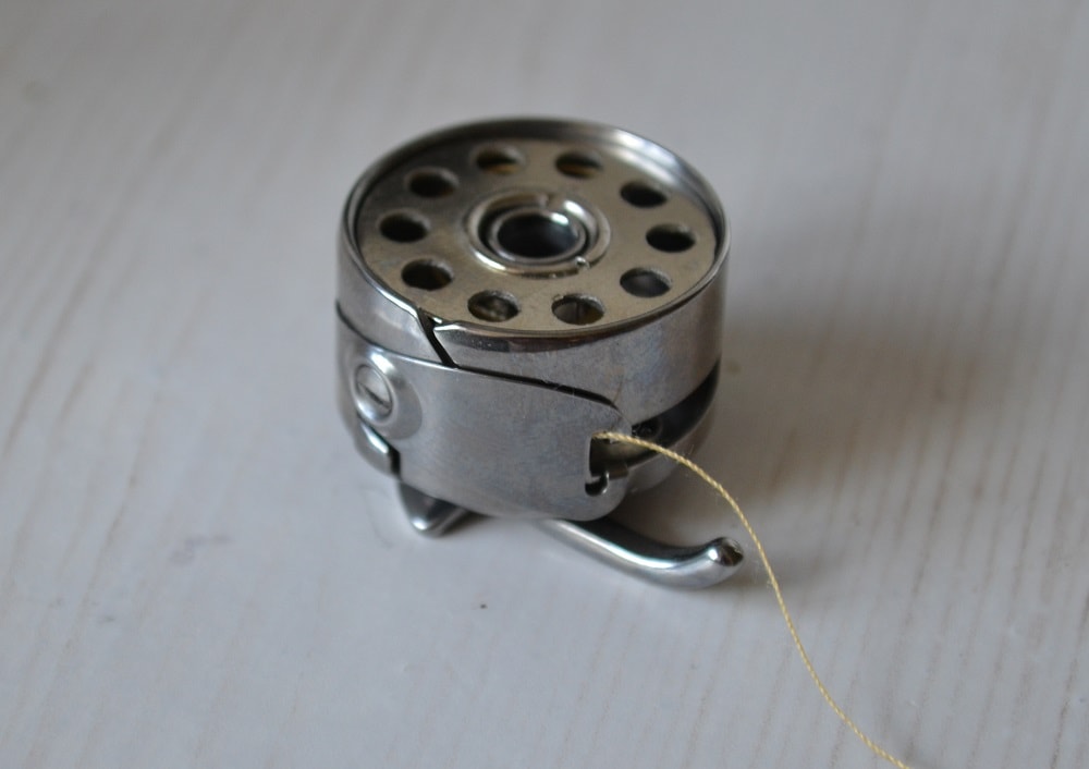 Insert the bobbin into the bobbin case