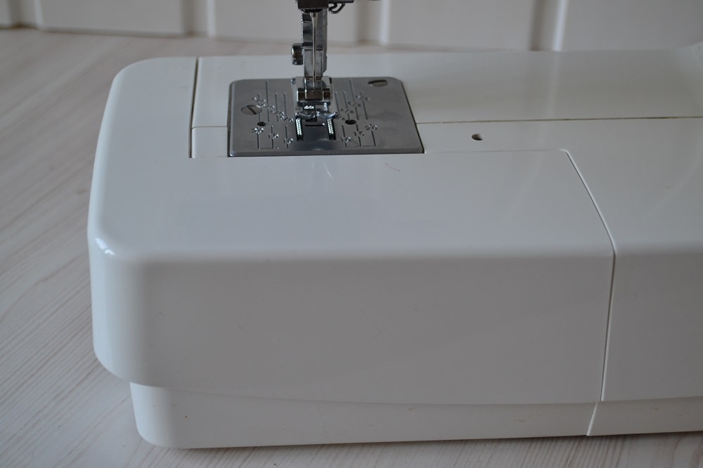 Insert removable table to body of sewing machine