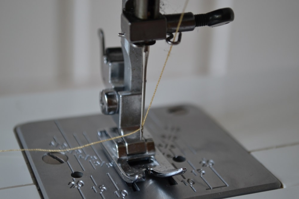 Insert the thread into needle eye
