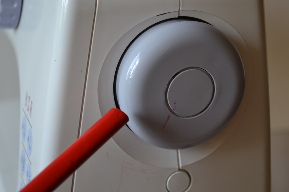 The manually turning a hand wheel