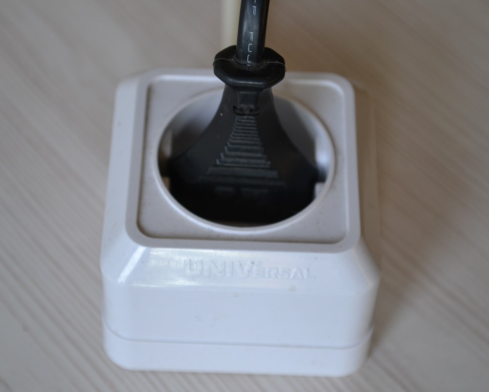 Plug power cord into an electrical outlet
