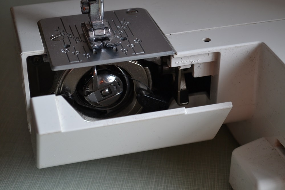 Front loading bobbin cover