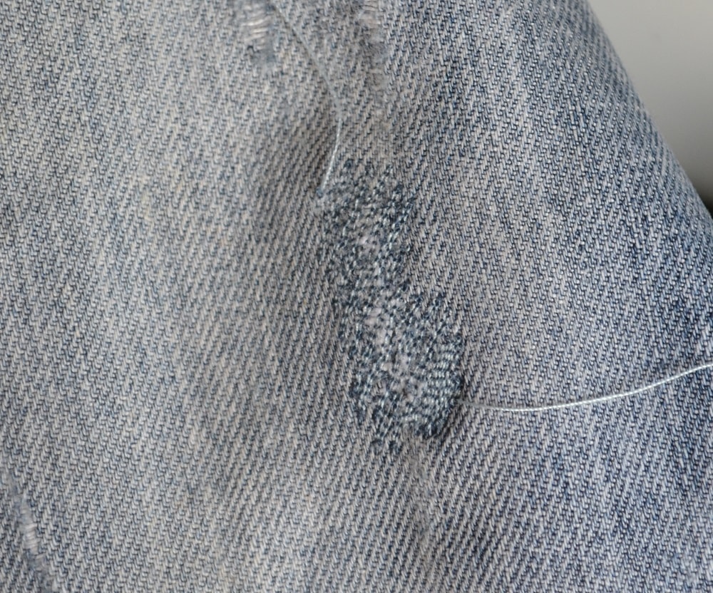 Mending the rips in denim jeans