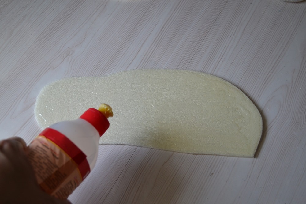 Apply glue to surface of slippers sole