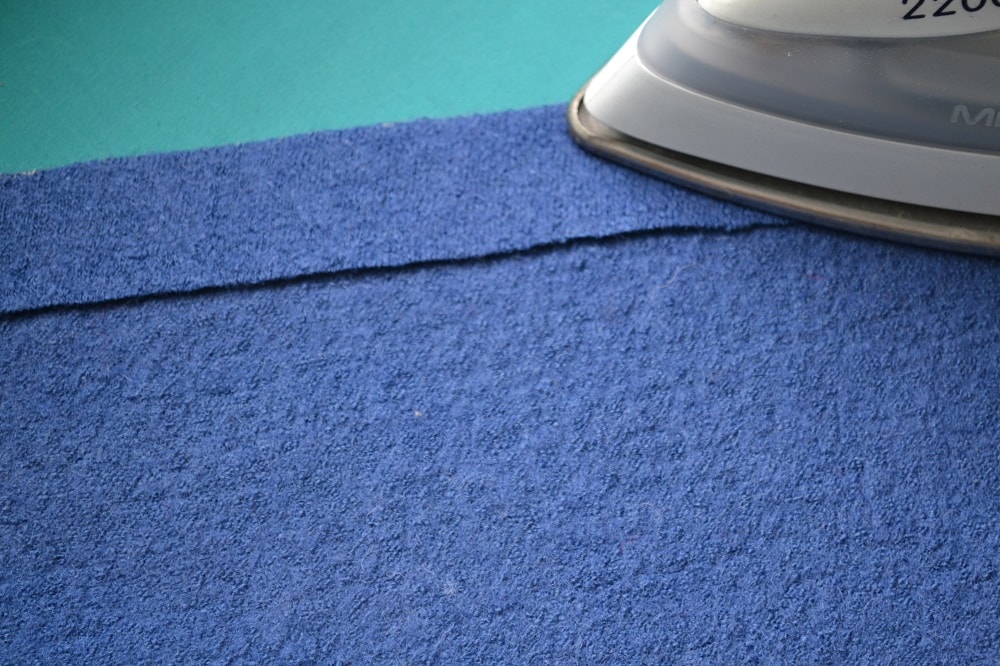 Fold the fabric and press it