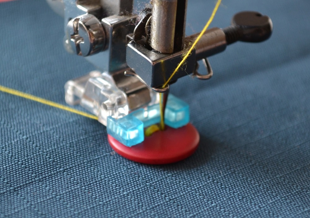 Sew on the button to garment
