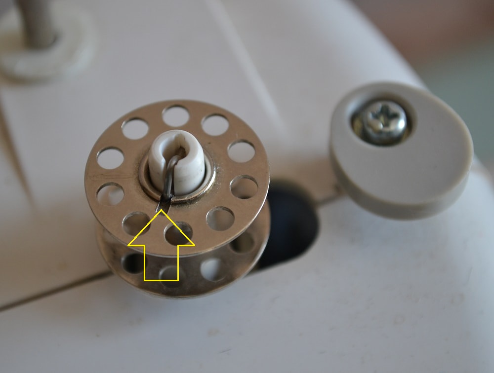 Bobbin inner hole with a slot into