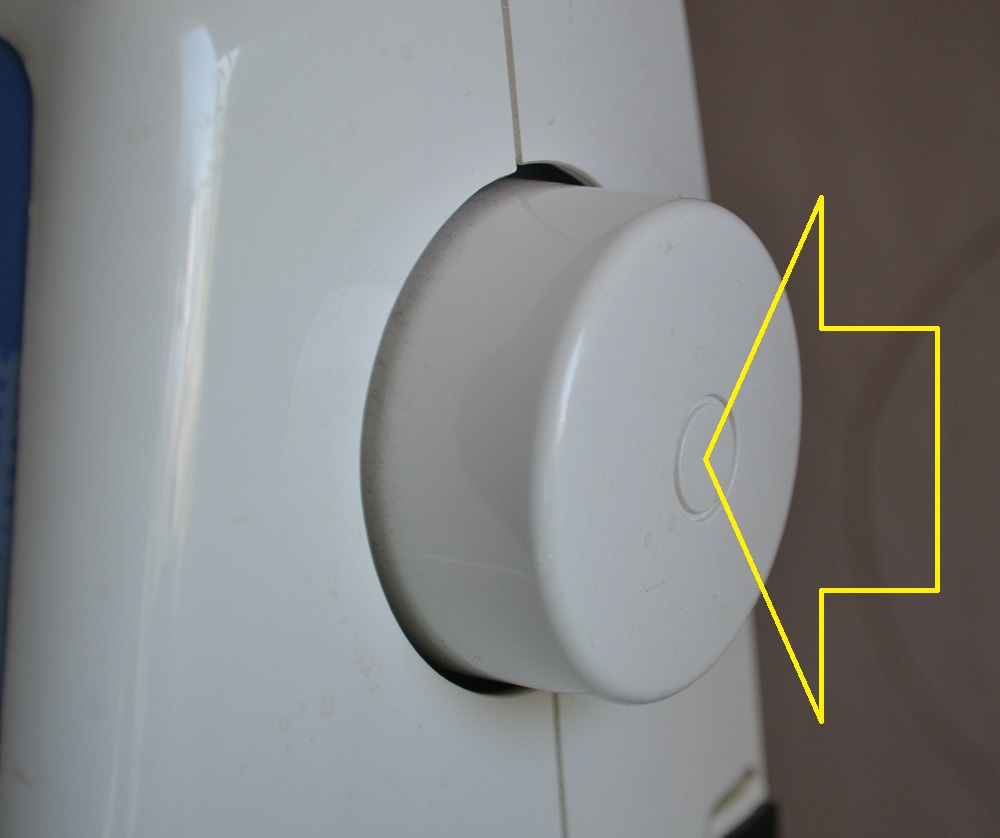 Press a flywheel towards a sewing machine body