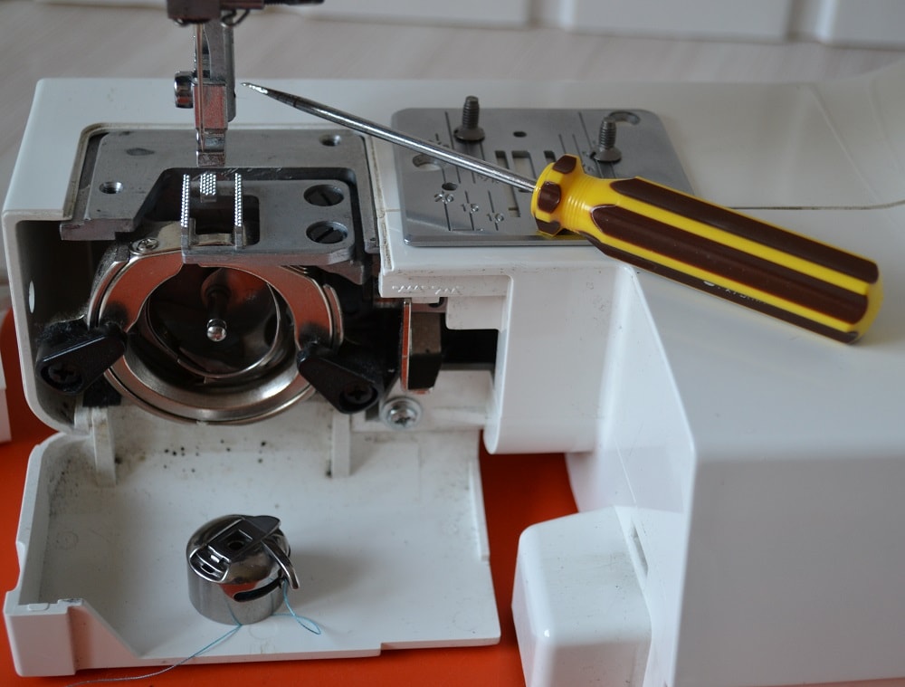 Removing a needle plate