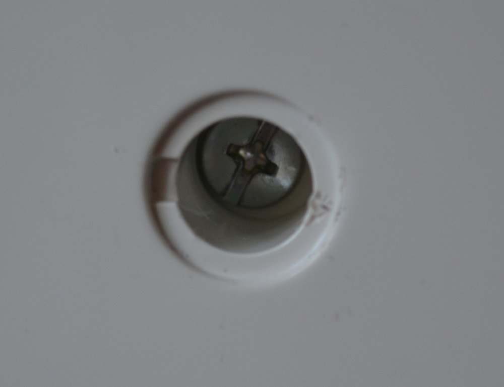 Pull away an inner screw with tweezers