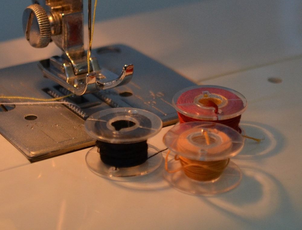Plastic bobbin better glide into bobbin case