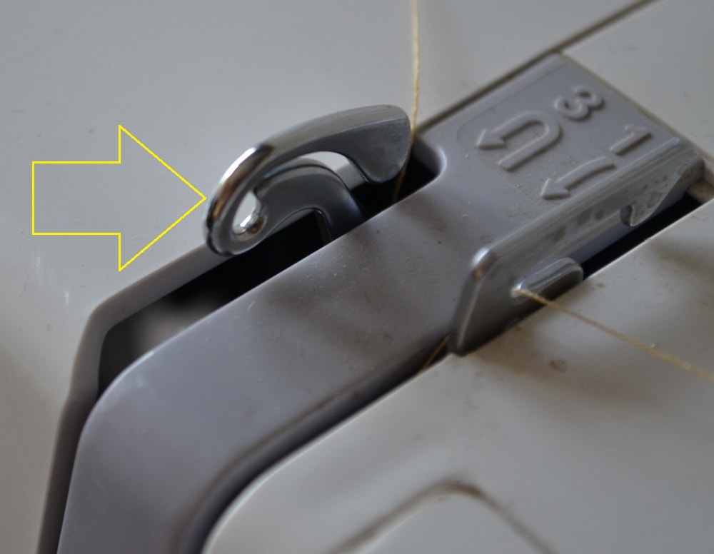 Needle position and thread take-up lever