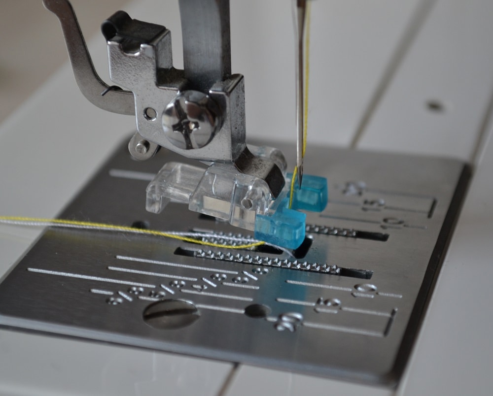Thread pull under presser foot sole