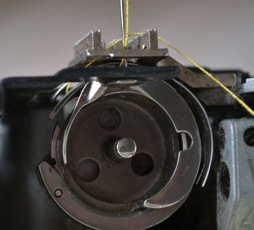 Hook tip pull needle thread down