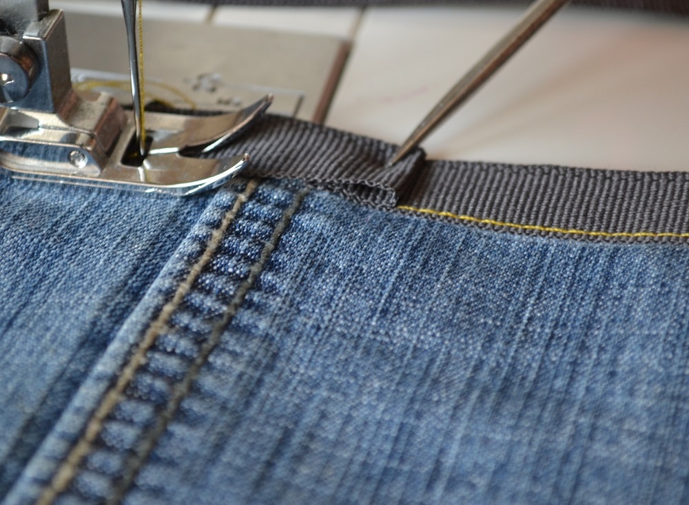 Turn tape inwards and stitch it