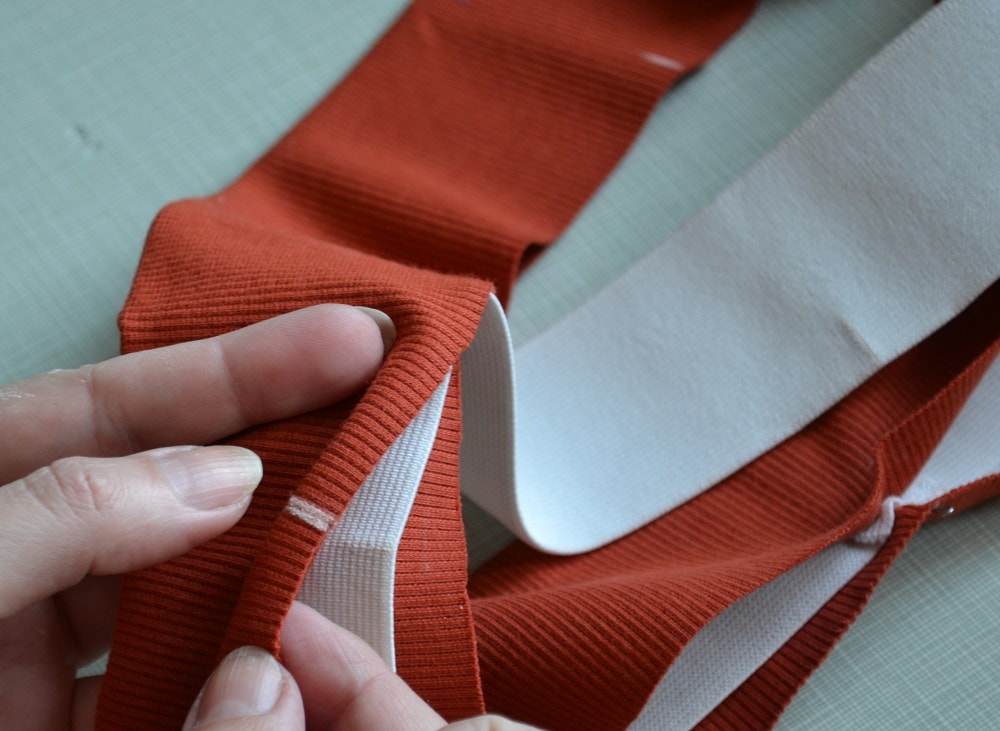 Insert the elastic tape into folded waistband