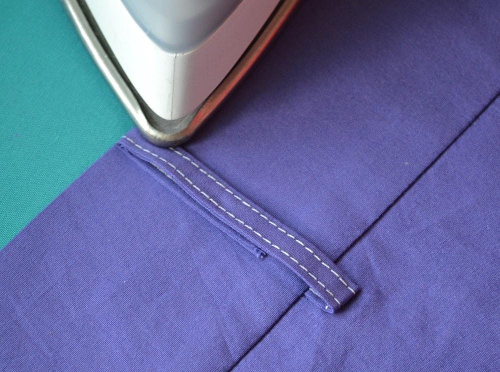 The upper end of folded belt loop