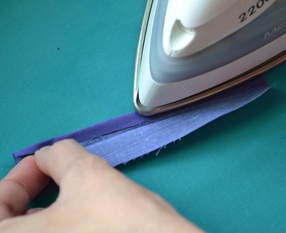 Fold edges of strip towards center line