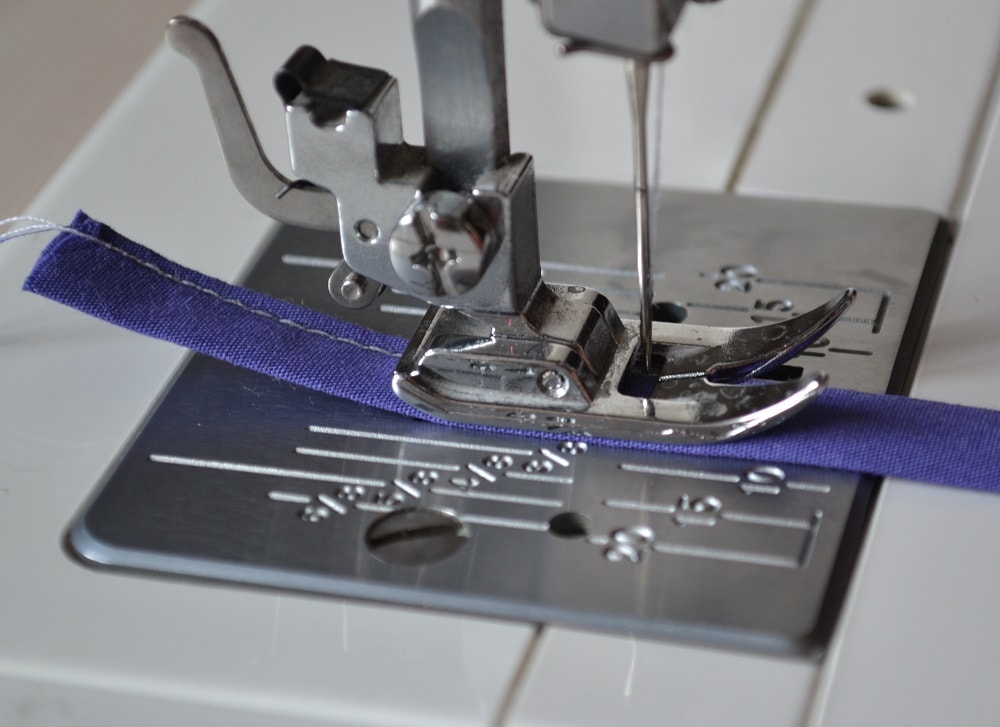 Sew close to edge of folded loop