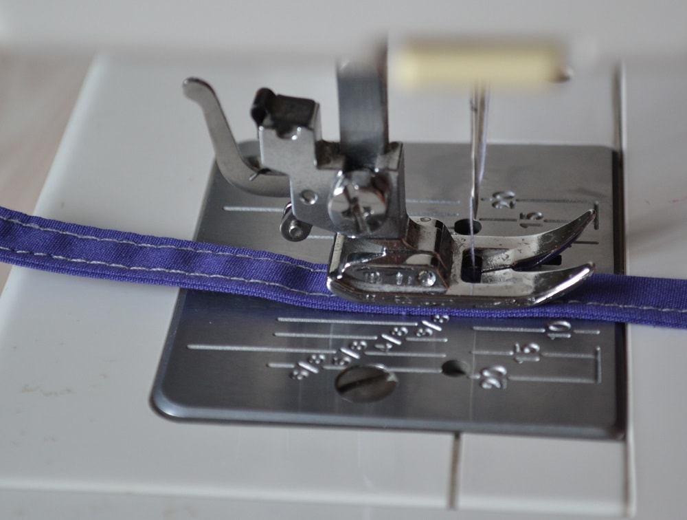 Sew along another edge of folded strip