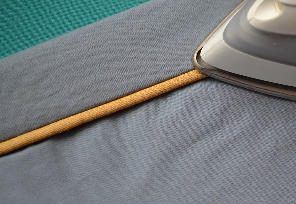 Piping with cord inside casing