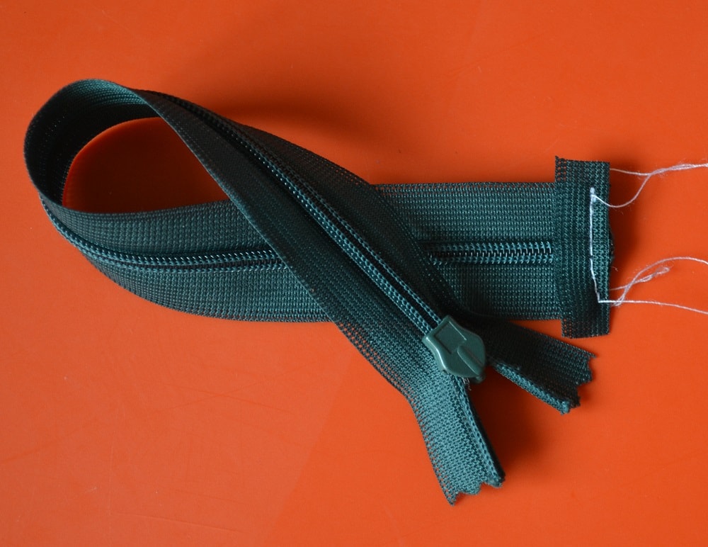 Make a few straight stitches across the tape