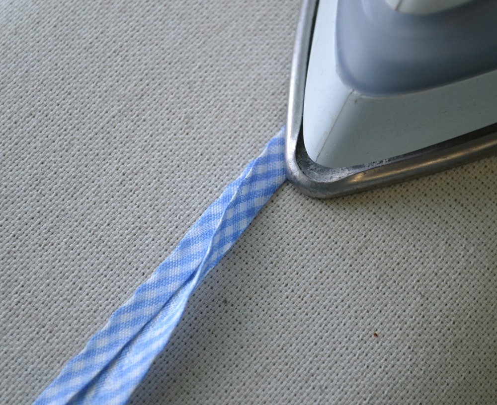 Fold the tape in half and press it