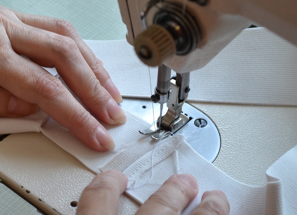Sew both elastic tape ends together