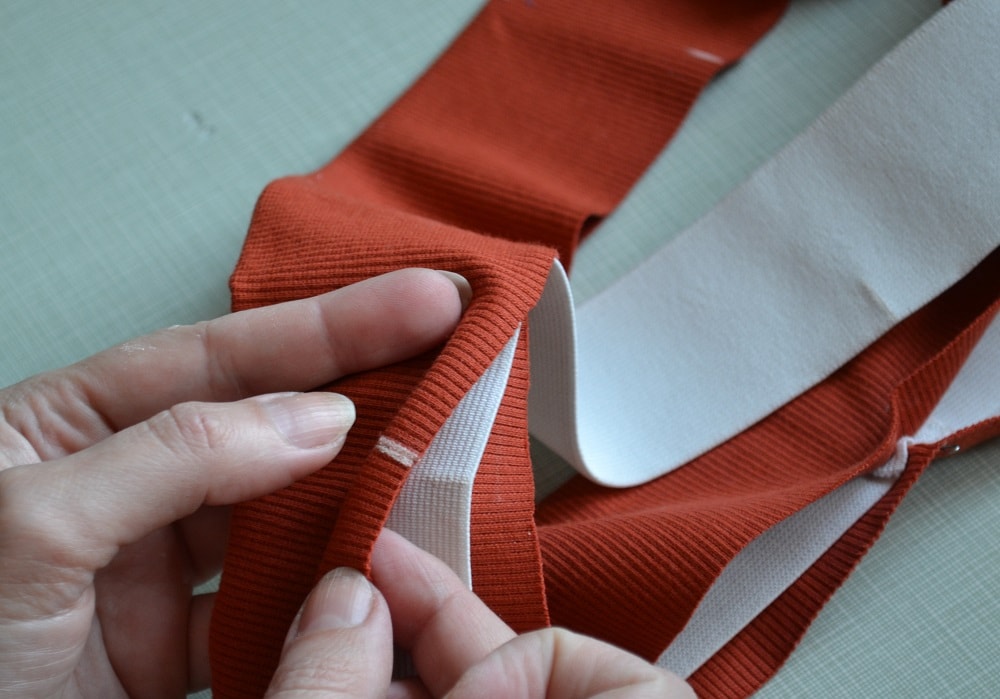 Fold your ribbed knit strip in half