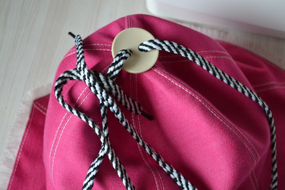 Button on the top of hat