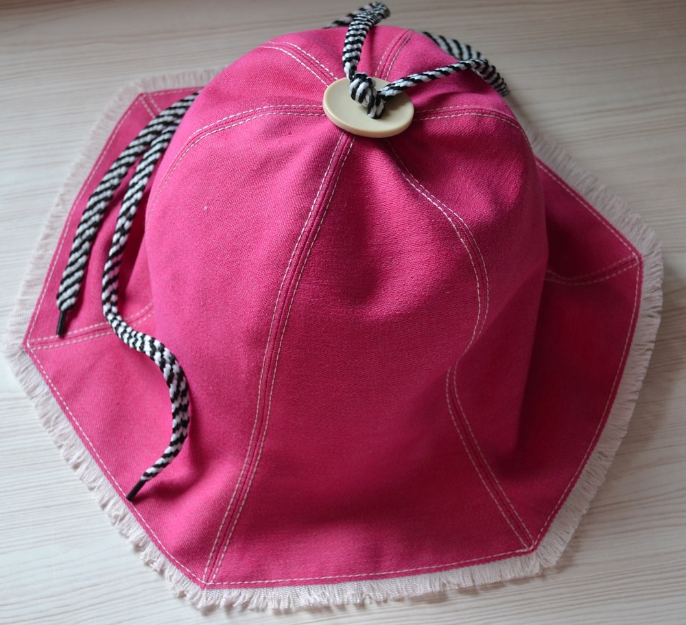 Long cord on the top a hat