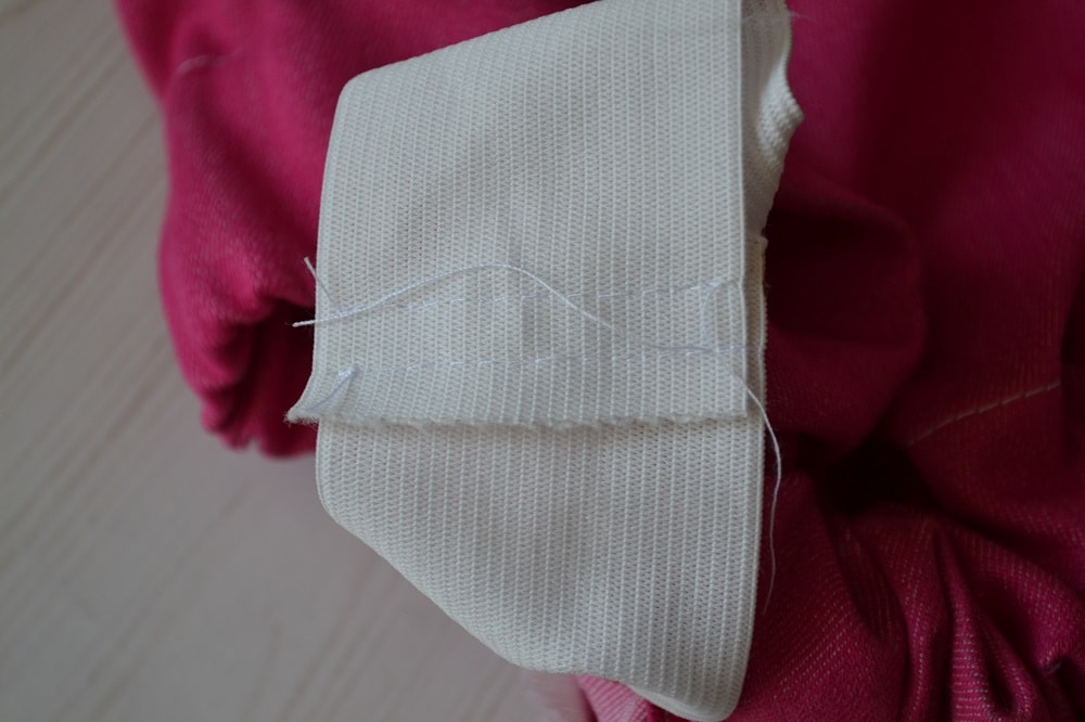 Sew both ends of elastic strip together