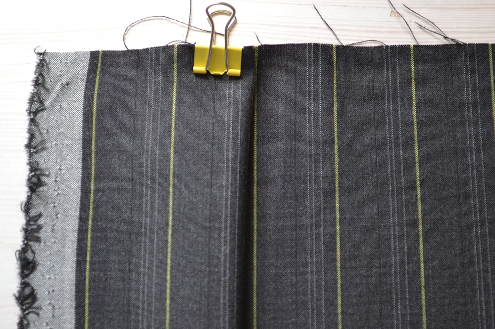 Baste the pleats before stitching