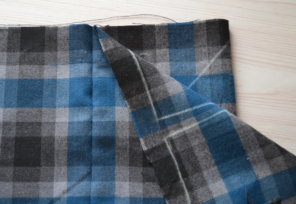Stitch along vertical line from waistline
