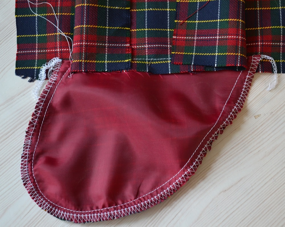 The side seams above ends of pocket hole