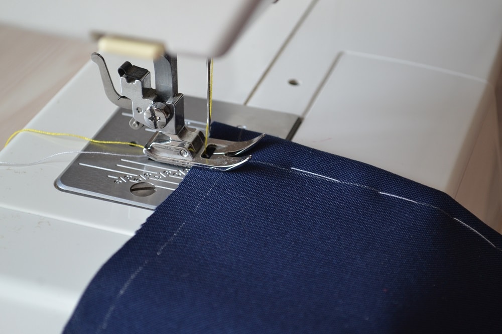 Turn a stitch length dial to 3-4