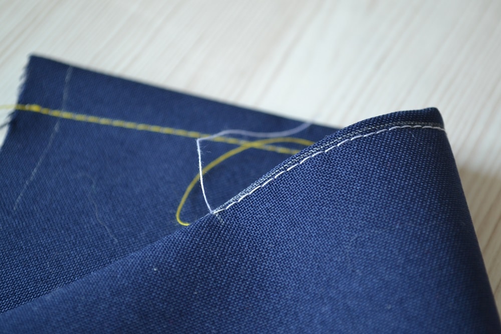 Stitches pass along marked line of dart