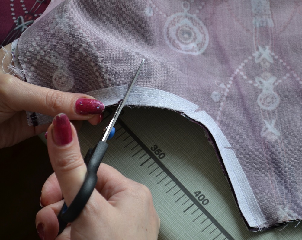 Trim the seam allowance along the curved pockets hole
