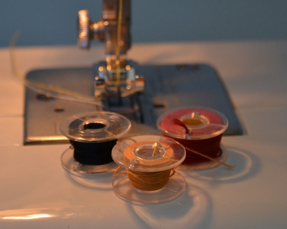 Use plastic bobbins