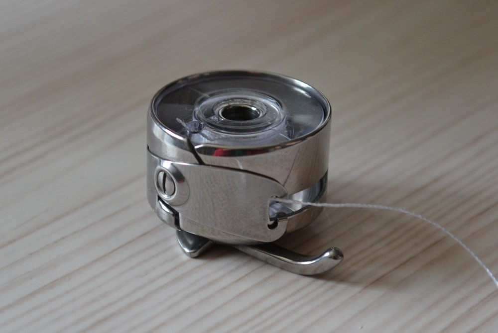 The bobbin thread under plate